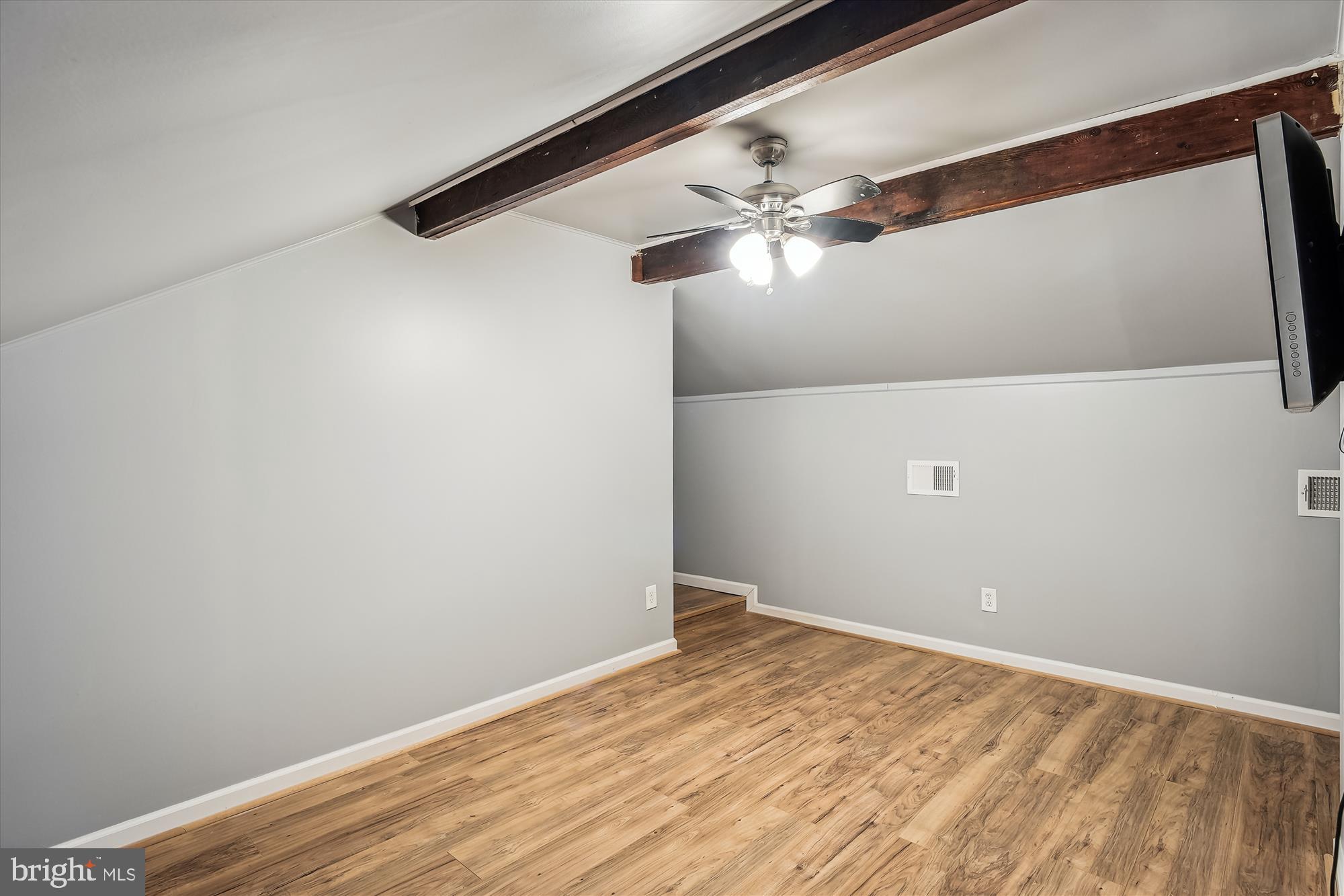 4860 28th Street South, Unit C2 Arlington, VA 22206 - Photo 24 of 34 Upstairs loft with exposed wood beams