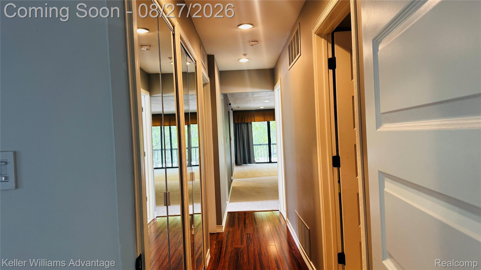 29726 Pine Ridge Circle Farmington, MI 48331 - Photo 35 of 42 Hallway with wood-finish flooring, recessed lighting, and mirrored closet doors