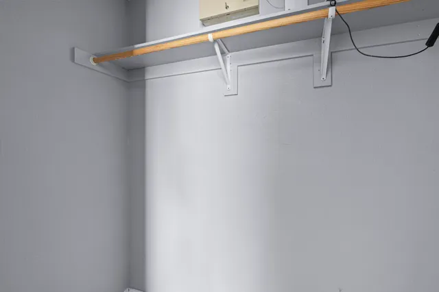 a view of a room with racks on the wall