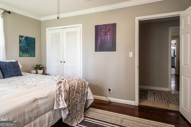 a view of a hallway to a livingroom with furniture