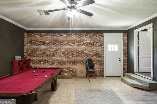 a living room with fireplace furniture and a flat screen tv
