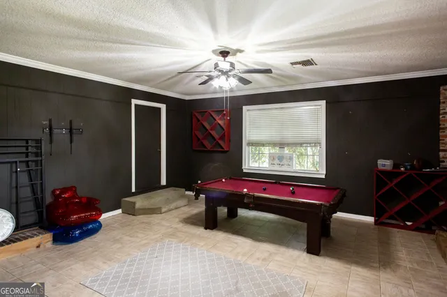 a view of a livingroom with furniture and a window
