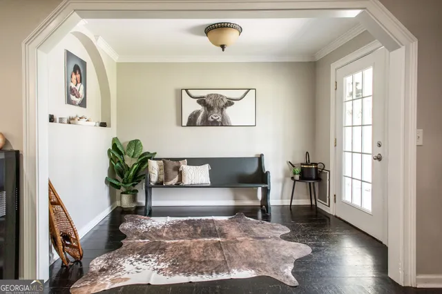 a view of a dining room with furniture window and wooden floor
