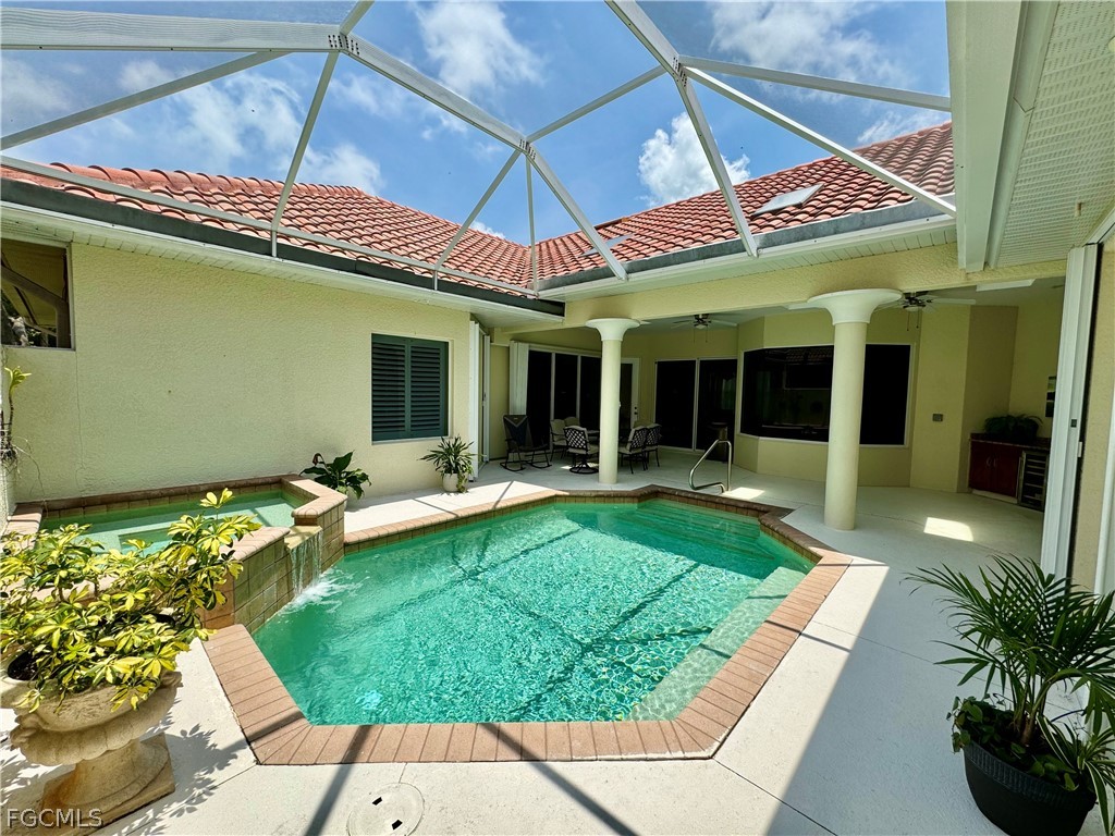 1740 Ludlow Road Marco Island, FL 34145 - Photo 11 of 47 a view of a chairs and table in patio