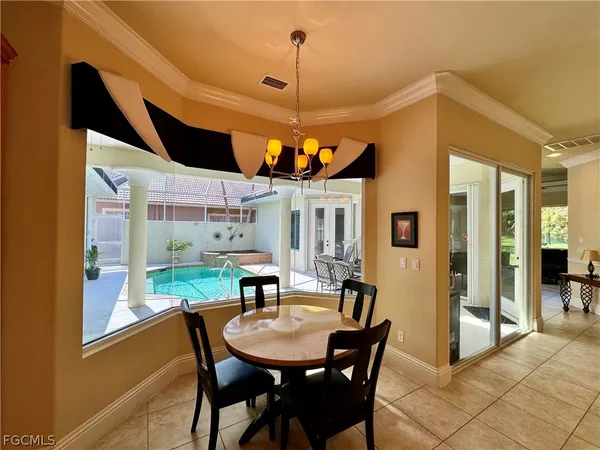 a dining room with furniture and window