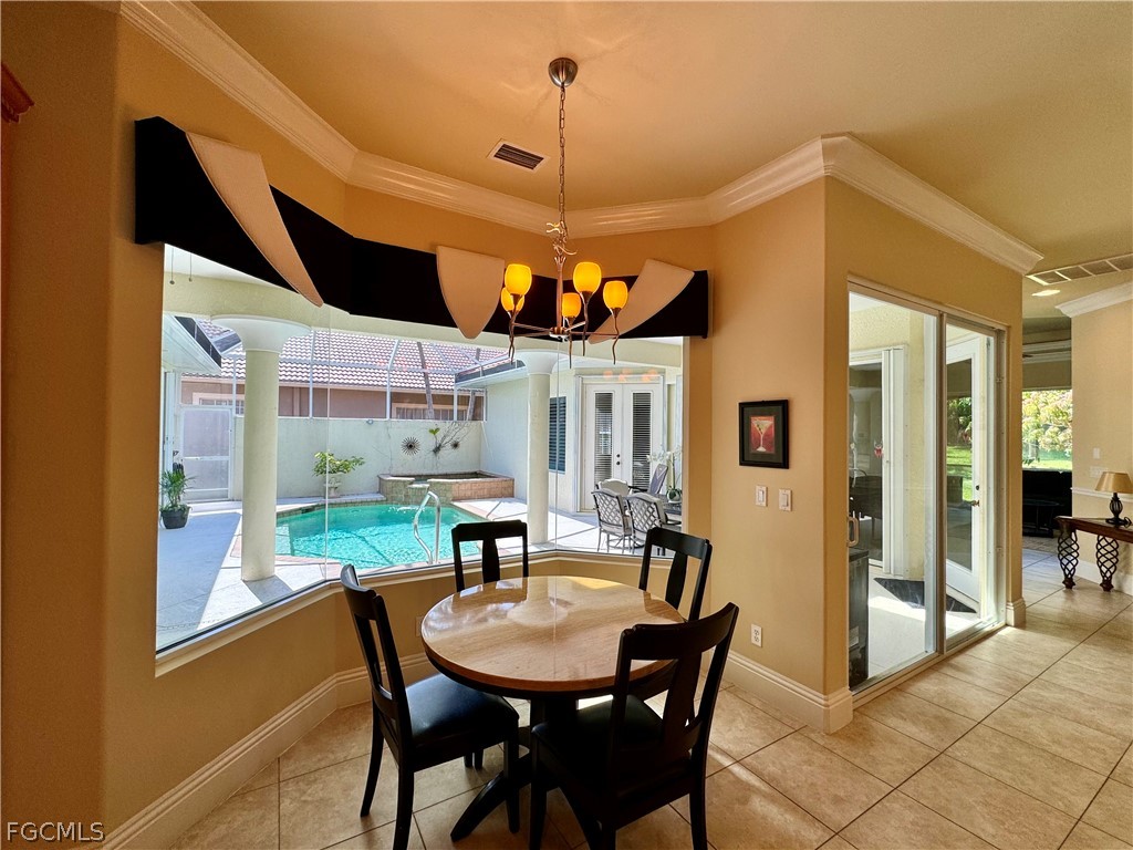 1740 Ludlow Road Marco Island, FL 34145 - Photo 15 of 47 a dining room with furniture and window