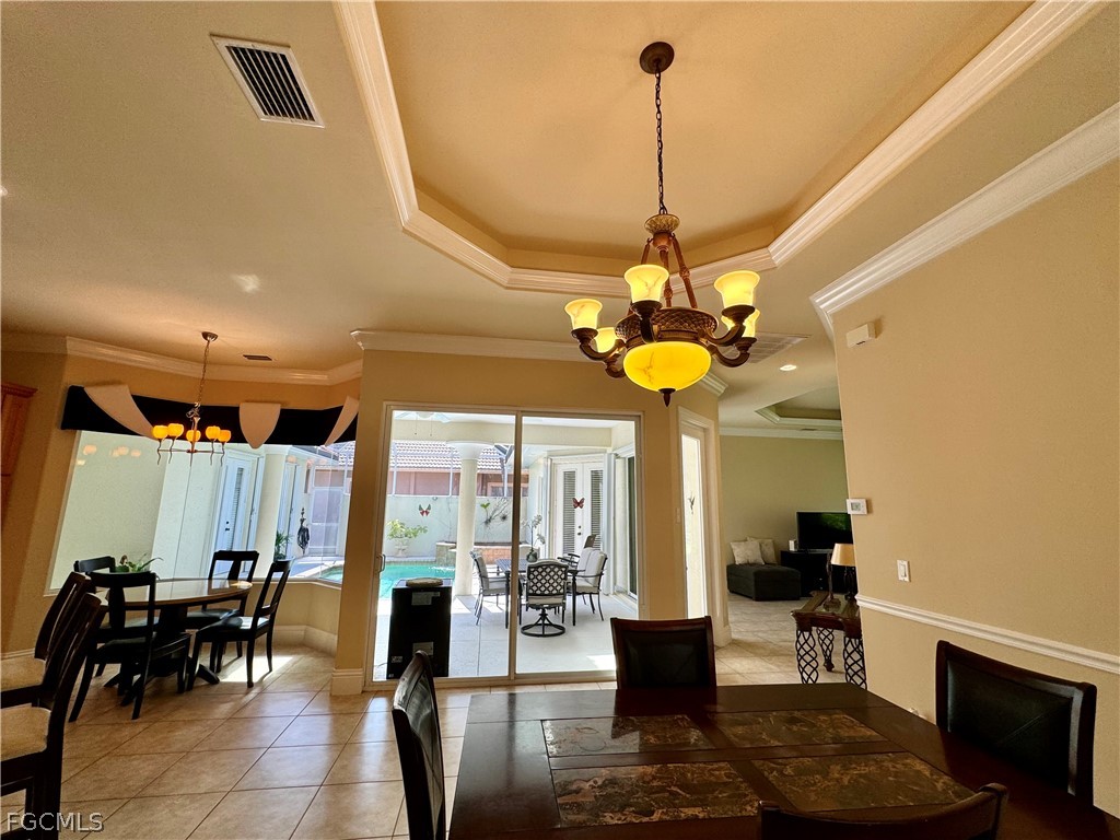 1740 Ludlow Road Marco Island, FL 34145 - Photo 19 of 47 a view of a dining room with furniture window and outside view