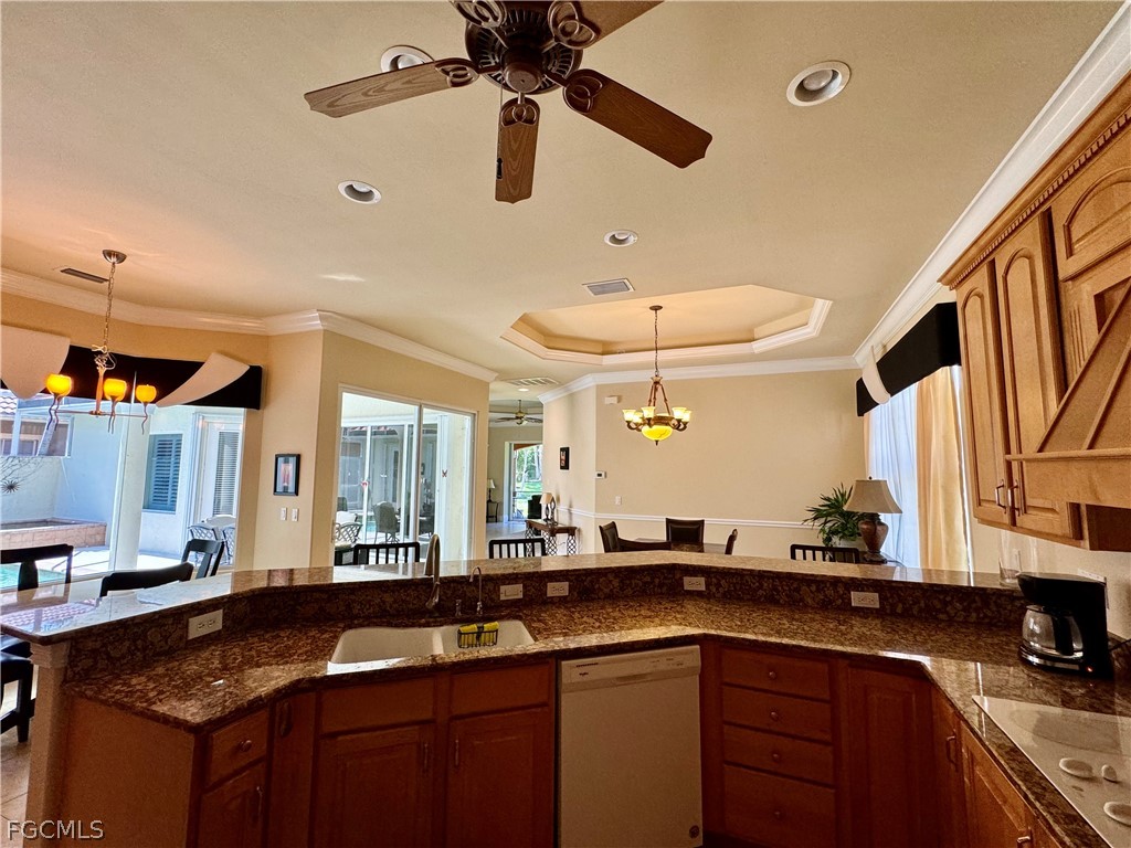 1740 Ludlow Road Marco Island, FL 34145 - Photo 21 of 47 a kitchen with a sink and chandelier