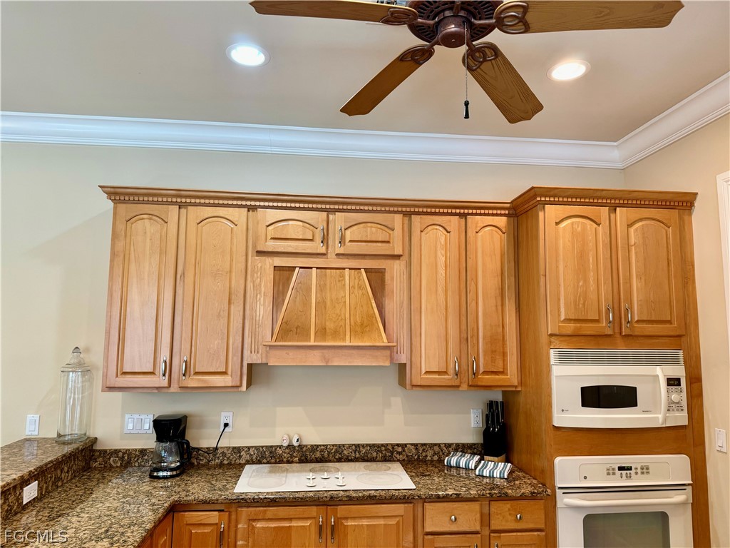 1740 Ludlow Road Marco Island, FL 34145 - Photo 23 of 47 a kitchen with stainless steel appliances granite countertop a stove a sink and a microwave