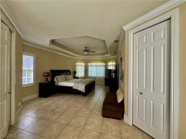 a bedroom with a bed and a mirror
