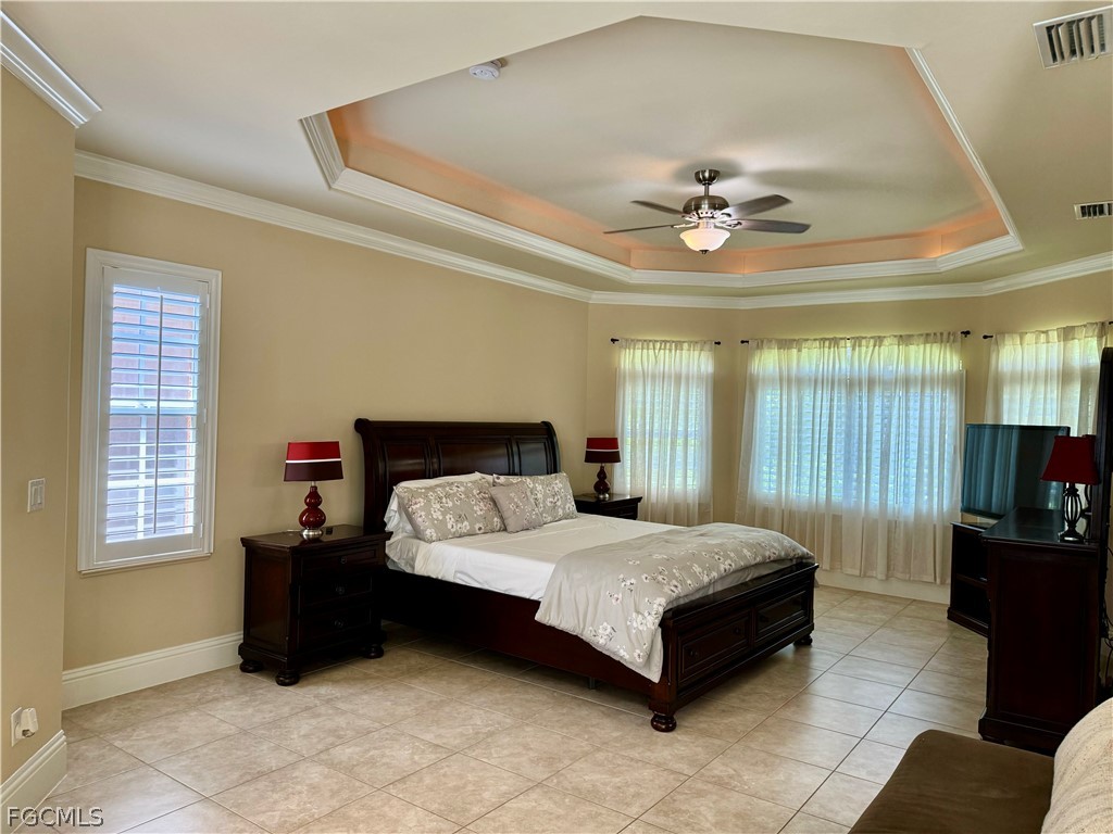 1740 Ludlow Road Marco Island, FL 34145 - Photo 27 of 47 a bedroom with a bed couch and window