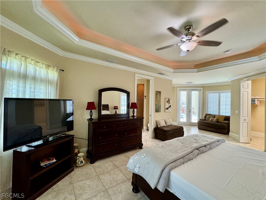 1740 Ludlow Road Marco Island, FL 34145 - Photo 29 of 47 a bedroom with a bed and a flat screen tv