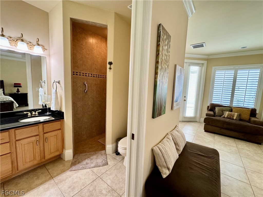 1740 Ludlow Road Marco Island, FL 34145 - Photo 31 of 47 a spacious bedroom with a bed and a couch