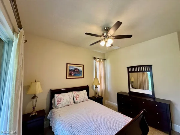 a bedroom with a bed and a dresser