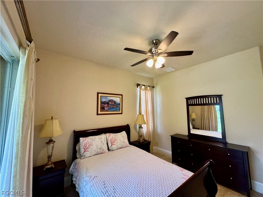 1740 Ludlow Road Marco Island, FL 34145 - Photo 34 of 47 a bedroom with a bed and a dresser