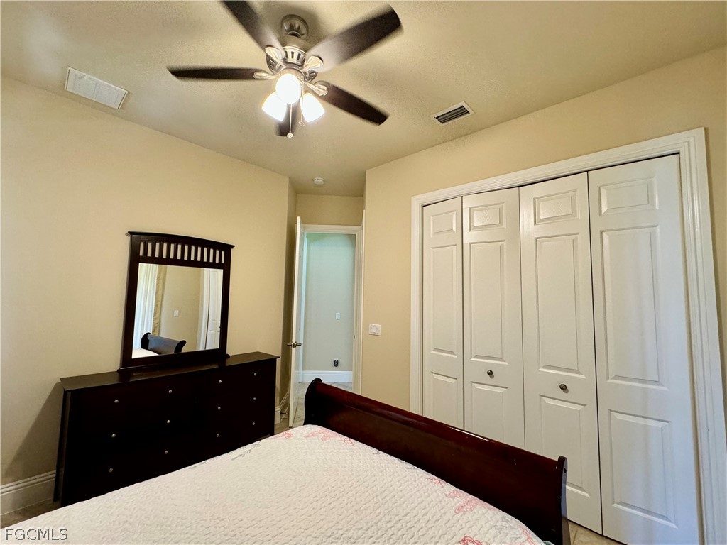 1740 Ludlow Road Marco Island, FL 34145 - Photo 37 of 47 a bedroom with a bed and a bathroom