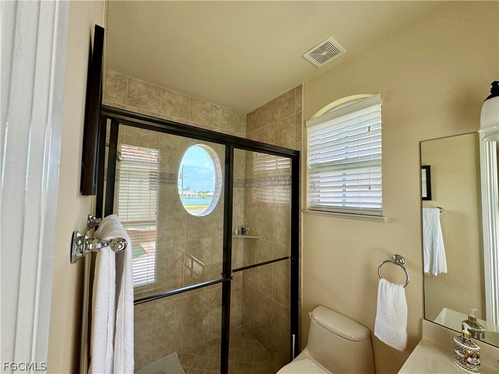 1740 Ludlow Road Marco Island, FL 34145 - Photo 41 of 47 a bathroom with a sink and a mirror