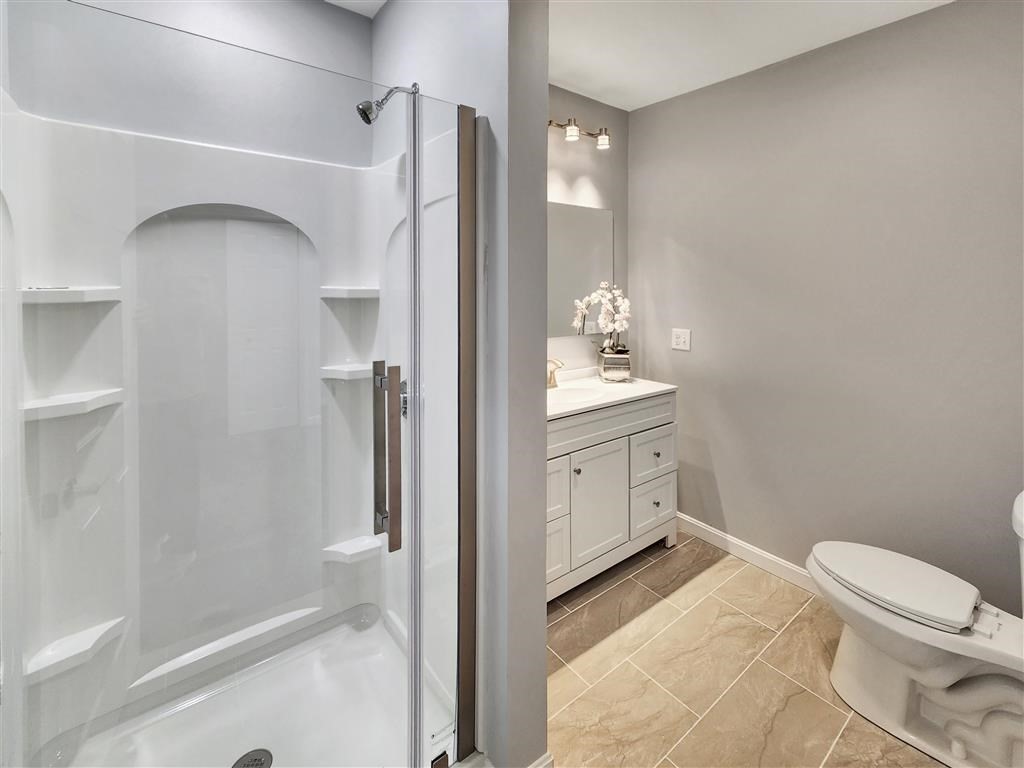 144 Rounds Street New Bedford, MA 02740 - Photo 11 of 20 a bathroom with a sink a toilet and shower