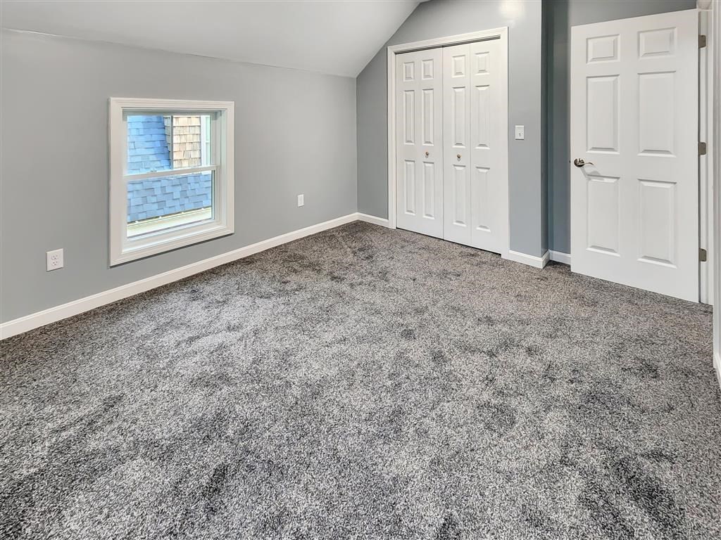 144 Rounds Street New Bedford, MA 02740 - Photo 17 of 20 an empty room with windows and closet