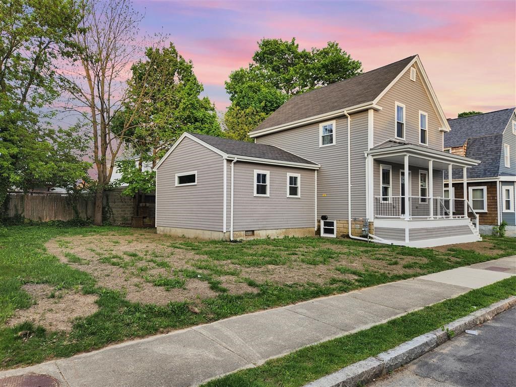144 Rounds Street New Bedford, MA 02740 - Photo 20 of 20 a front view of a house with a garden