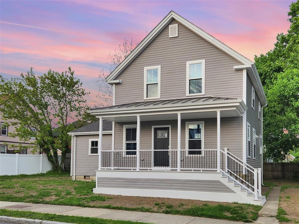 144 Rounds Street New Bedford, MA 02740 - Photo 2 of 20 a front view of a house with a yard