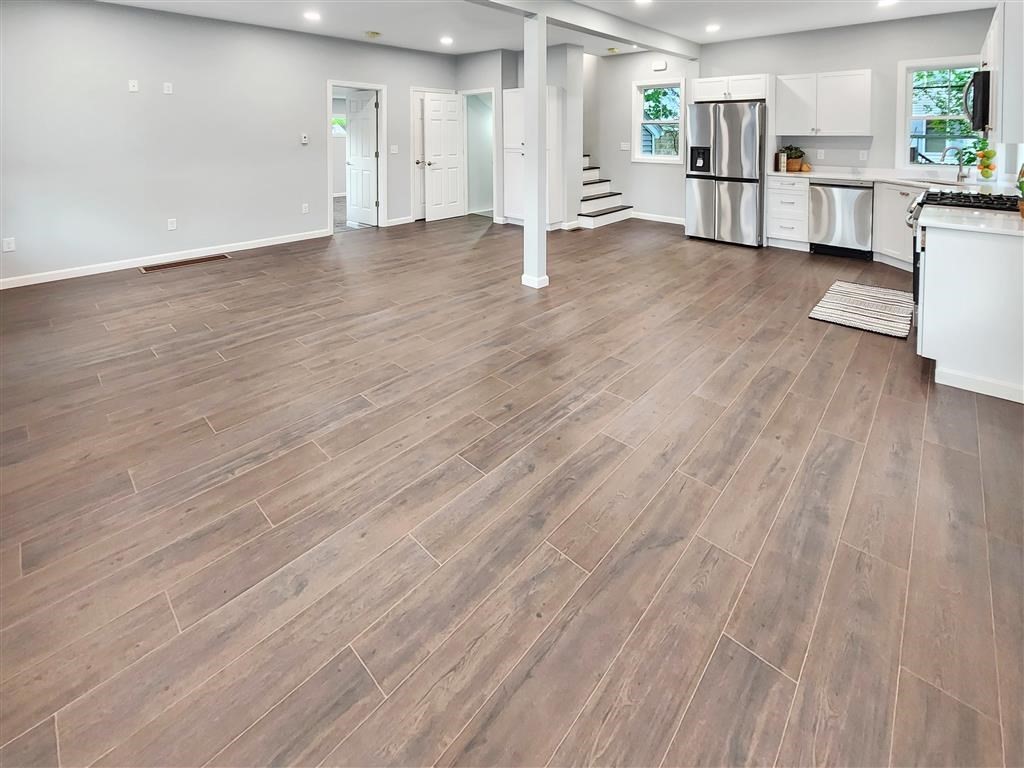 144 Rounds Street New Bedford, MA 02740 - Photo 4 of 20 a view of a kitchen with cabinets and wooden floor