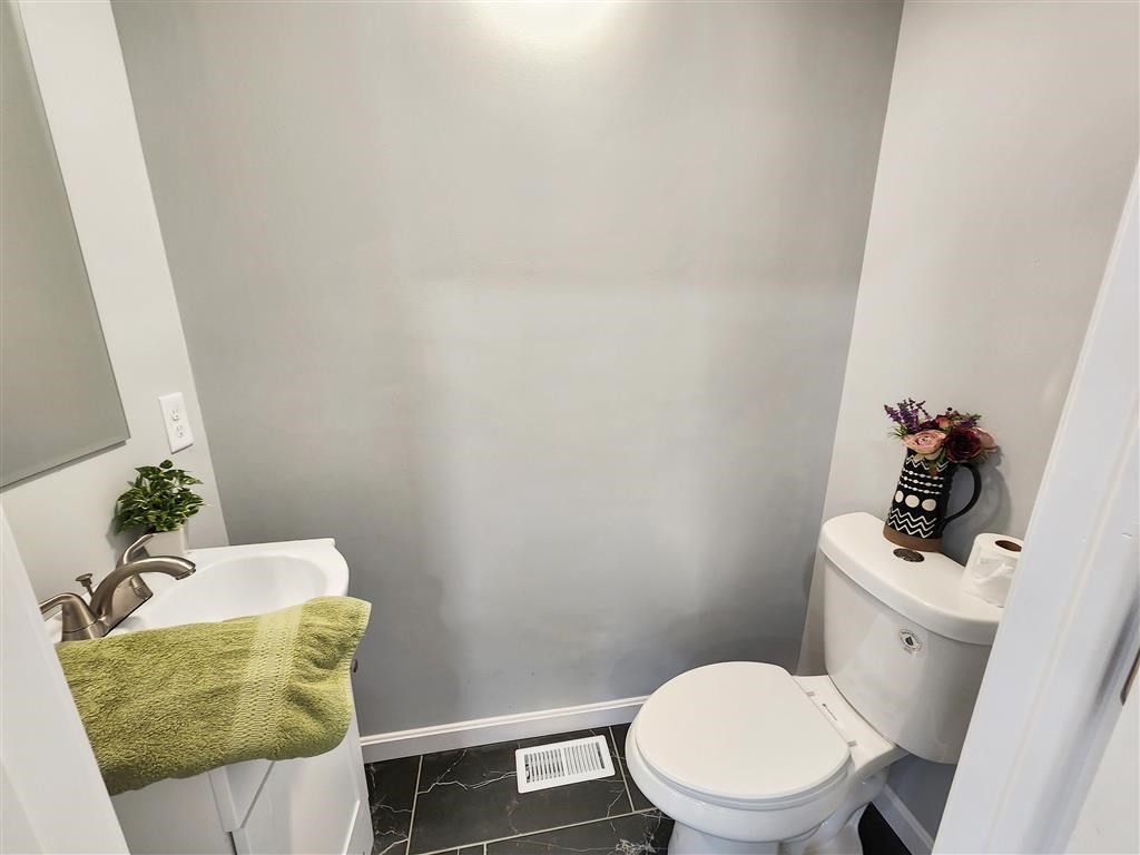 144 Rounds Street New Bedford, MA 02740 - Photo 7 of 20 a bathroom with a toilet and a sink
