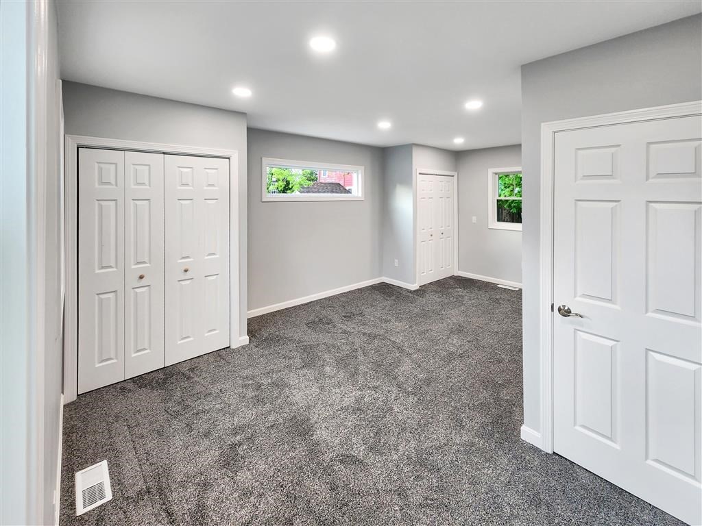 144 Rounds Street New Bedford, MA 02740 - Photo 8 of 20 an empty room with windows and closet