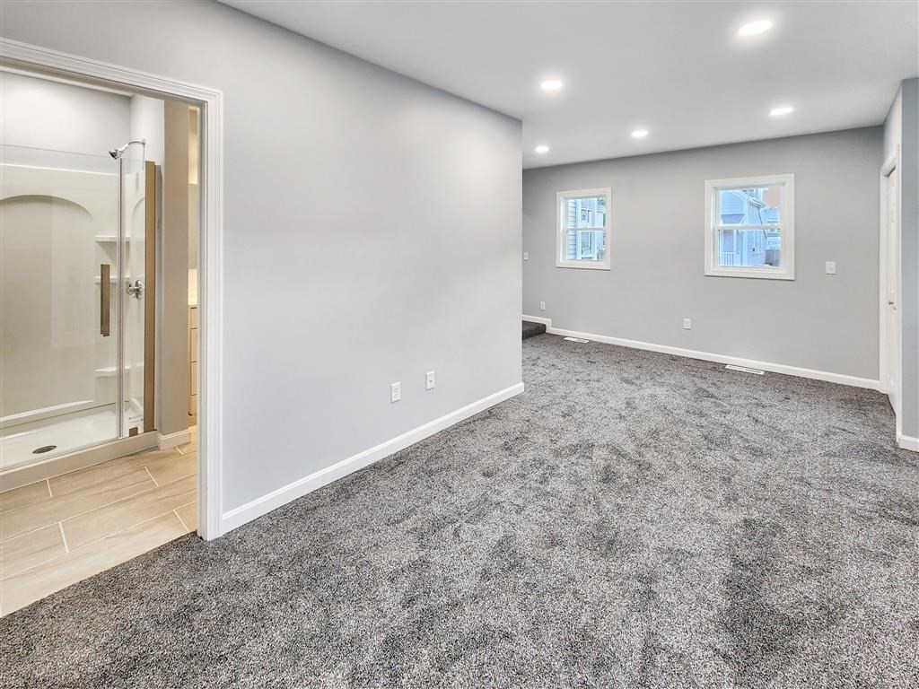 144 Rounds Street New Bedford, MA 02740 - Photo 10 of 20 an empty room with windows and closet