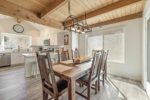 a view of a dining room with furniture and window