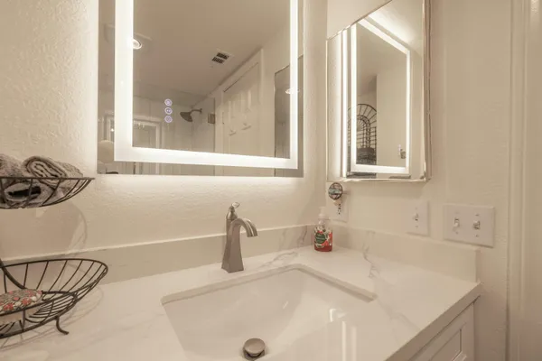a bathroom with a sink and a window