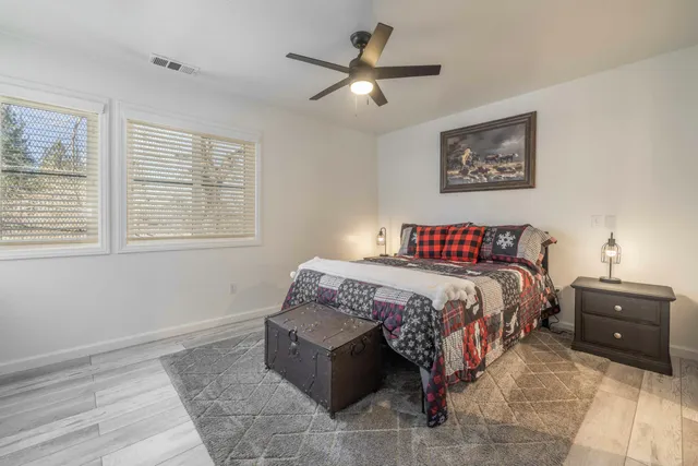 a bedroom with a bed and a tv