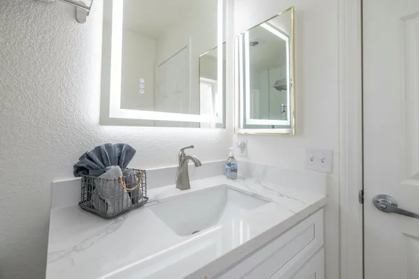 a bathroom with a sink and a mirror