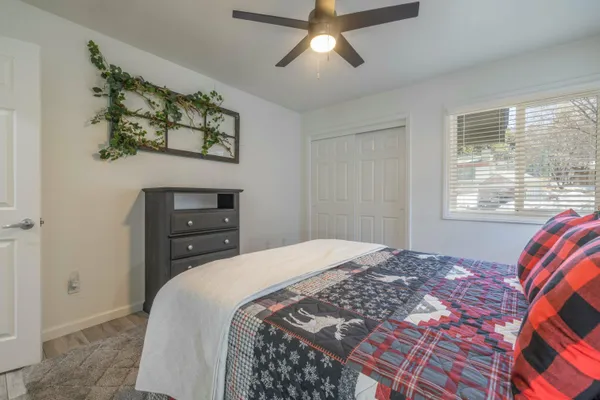 a bedroom with a bed and a window