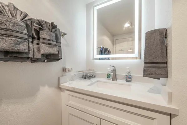 a bathroom with a sink and a mirror