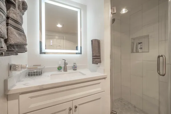 a bathroom with a sink and a mirror