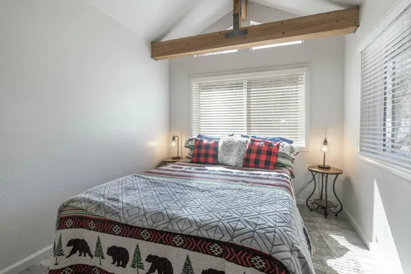 a bedroom with a bed and window