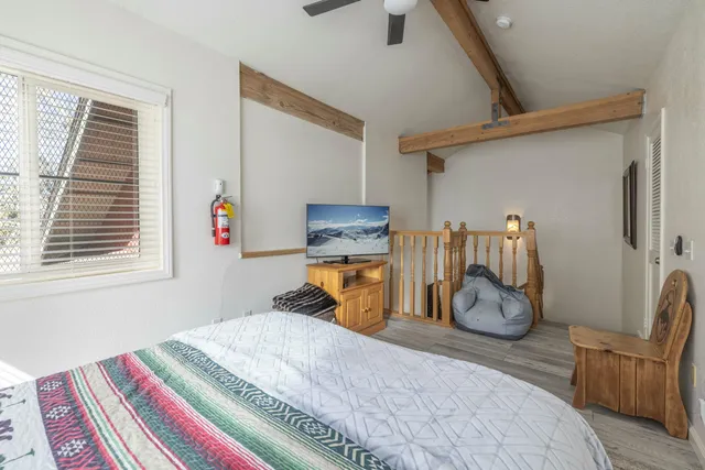 a bedroom with bed and a closet