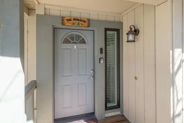 a view of front door with wooden door