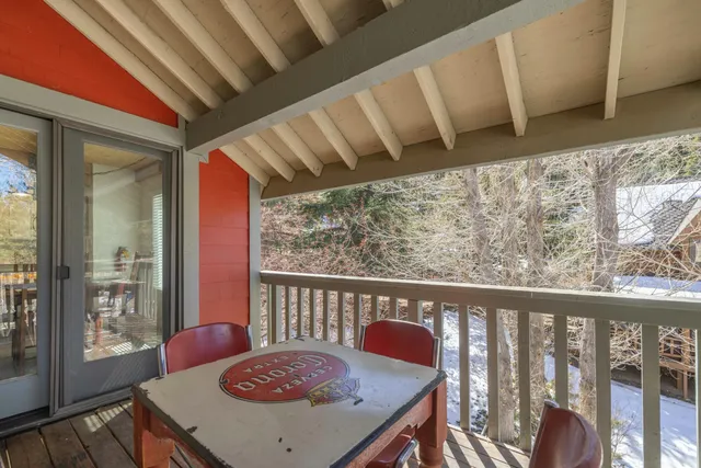 a view of a room with furniture and wooden floor