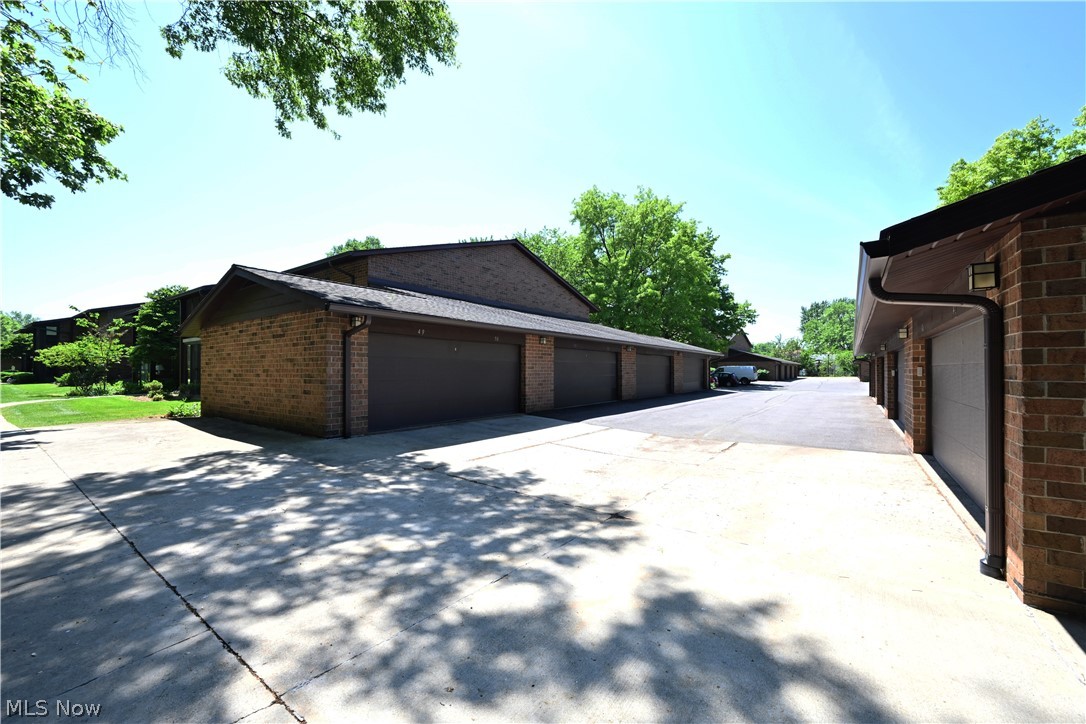22962 Maple Ridge Road, Unit 206 North Olmsted, OH 44070 - Photo 27 of 33 View of home's exterior with a garage