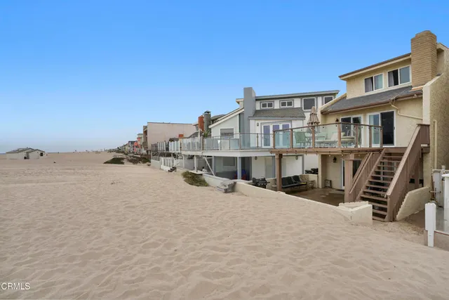 a front view of residential houses with outdoor space