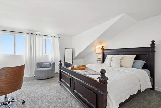 a bed room with a bed and a couch