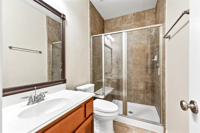 a view of a livingroom with wooden floor and a window