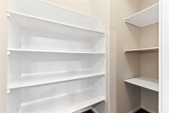 a front view of a house with yard and green space