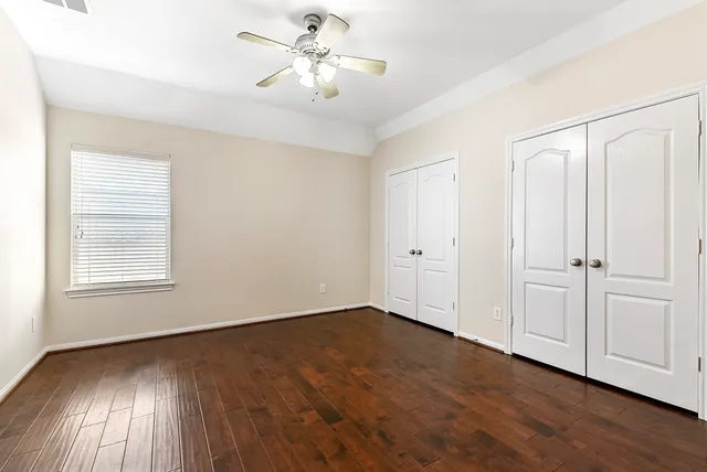 a view of a lake with houses in the back