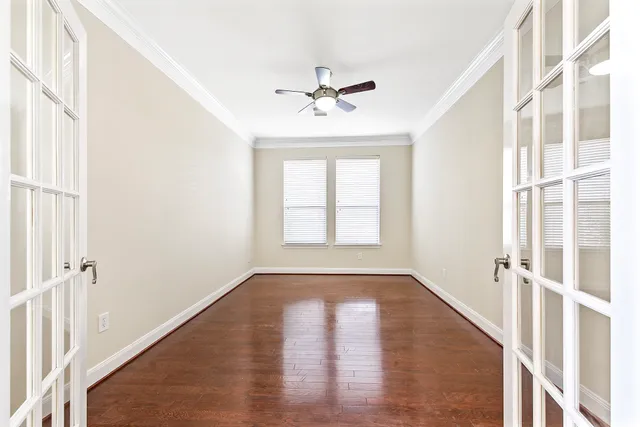 a view of livingroom with furniture fan and window