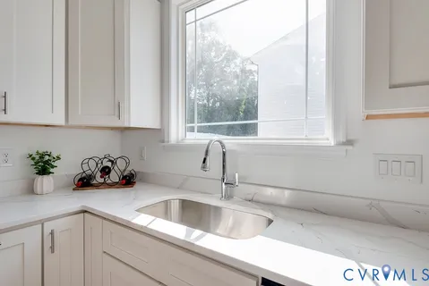 a kitchen with a sink and cabinets