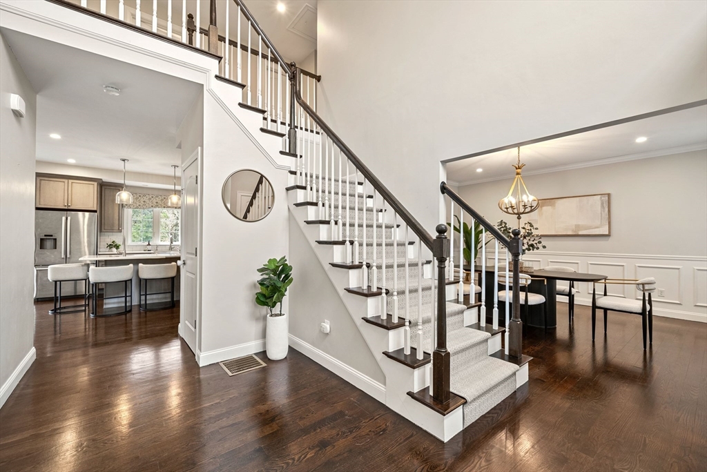 45 Saddleback Lane Canton, MA 02021 - Photo 15 of 42 a view of entryway dining room and hall with wooden floor