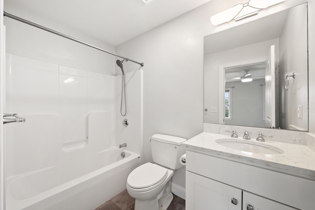 45 Saddleback Lane Canton, MA 02021 - Photo 22 of 42 a bathroom with a granite countertop sink a toilet and shower